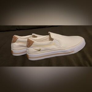 Nike Cream (Yellow) and Gold Detailing Slip-On Shoes
Size: 8.5 women’s